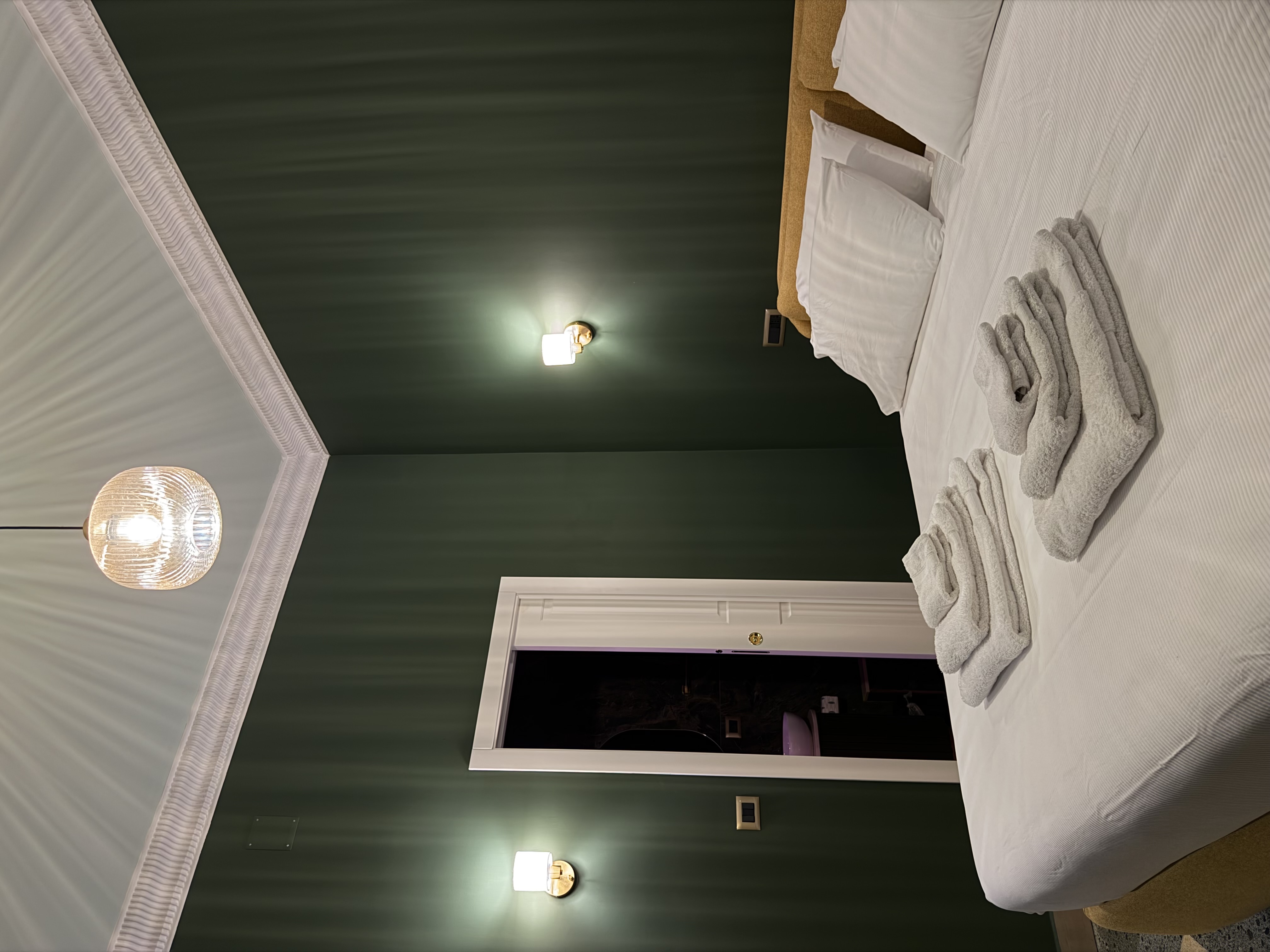 Sage-green room, with saxophone and guitar