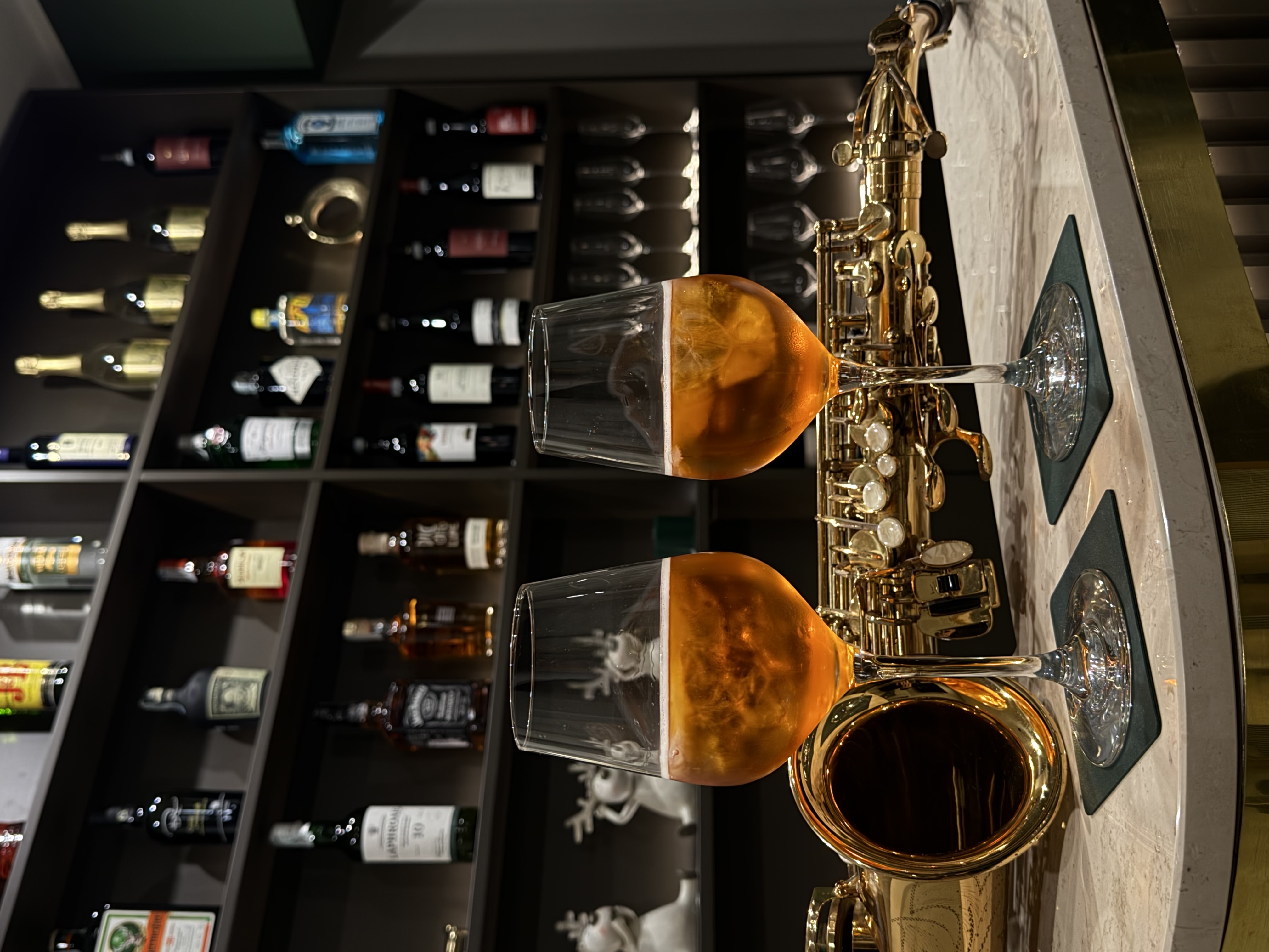 The bar counter with wines and crystal glassware